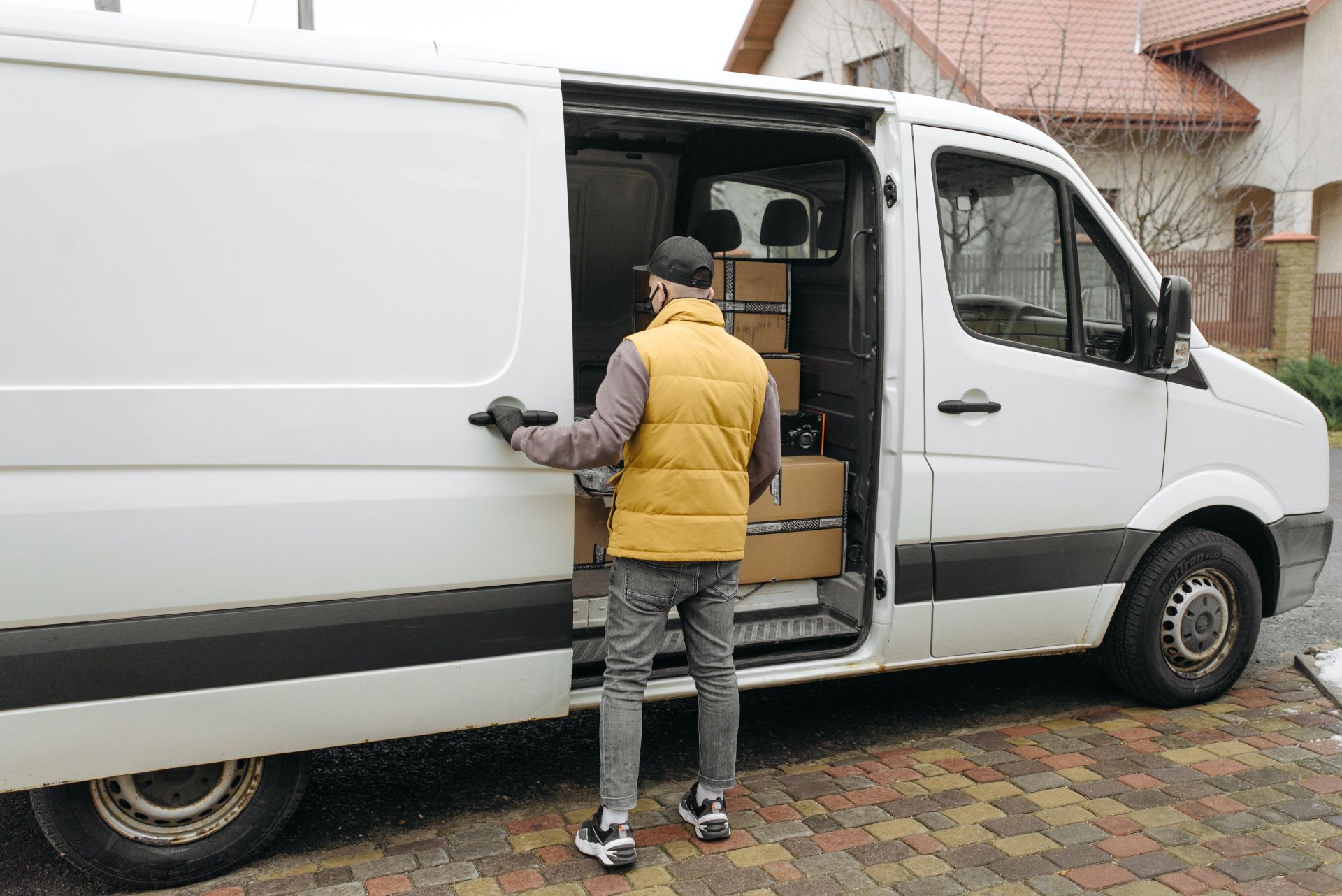 Man Opening a Door of a Delivery Van